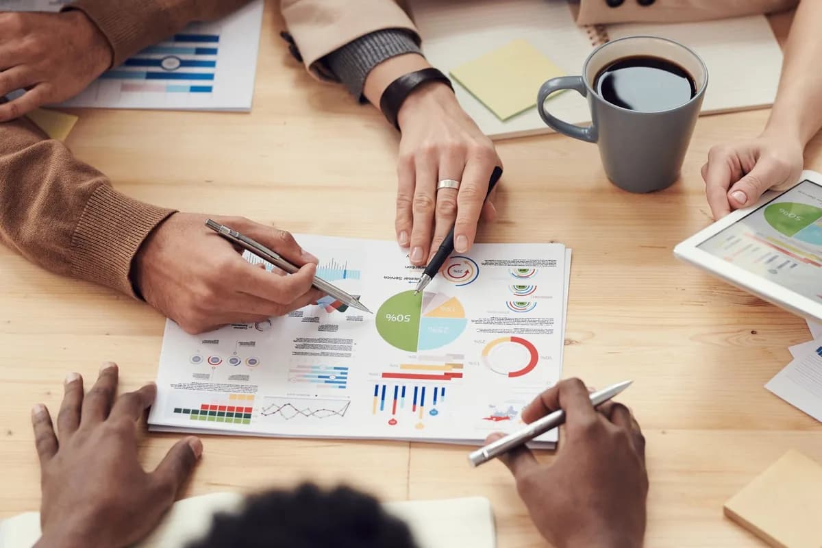 A team working through a capital structure at a desk